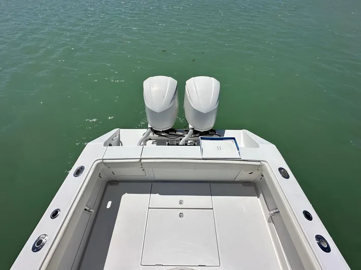  Yacht Photos Pics 2009 Jupiter 29 FS CC boat with dual outboard motors on calm water.