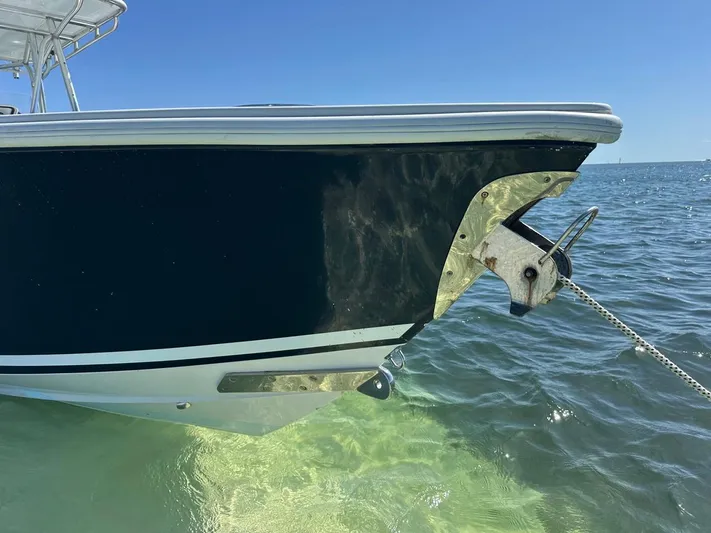  Yacht Photos Pics 2009 Jupiter 29 FS CC boat anchored in clear blue water.