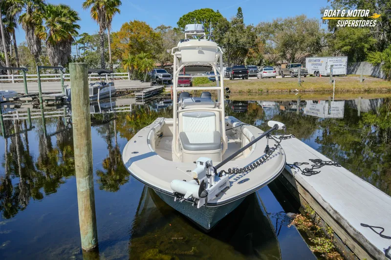  Yacht Photos Pics 2016 Young 27 boat docked at marina with palm trees and clear sky.
