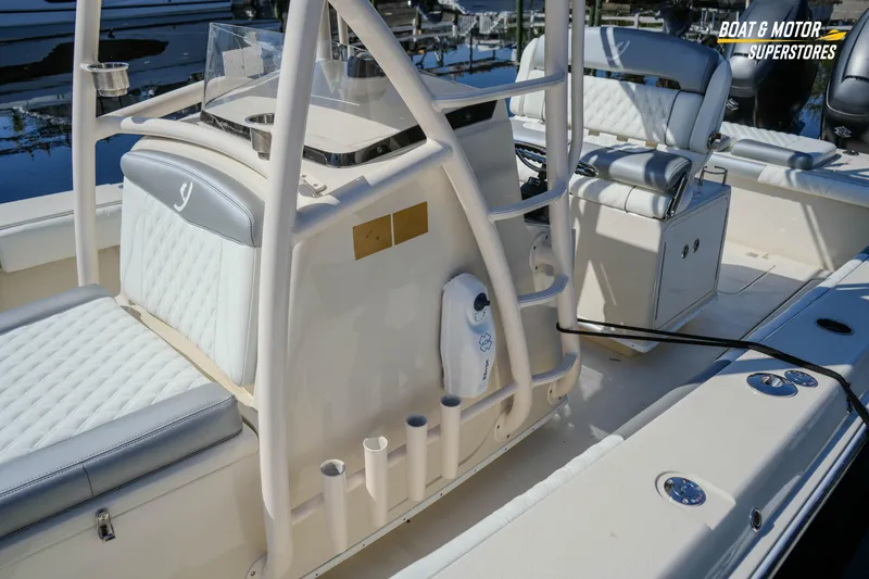  Yacht Photos Pics 2016 Young 27 boat interior with cushioned seating and rod holders.