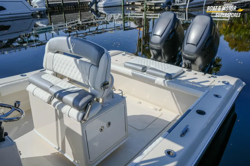  Yacht Photos Pics Luxury 2016 Young 27 boat interior with dual engines at a marina.