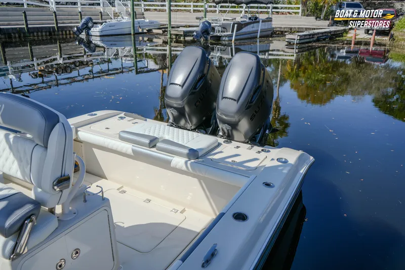  Yacht Photos Pics 2016 Young 27 boat with dual outboard motors docked at marina.