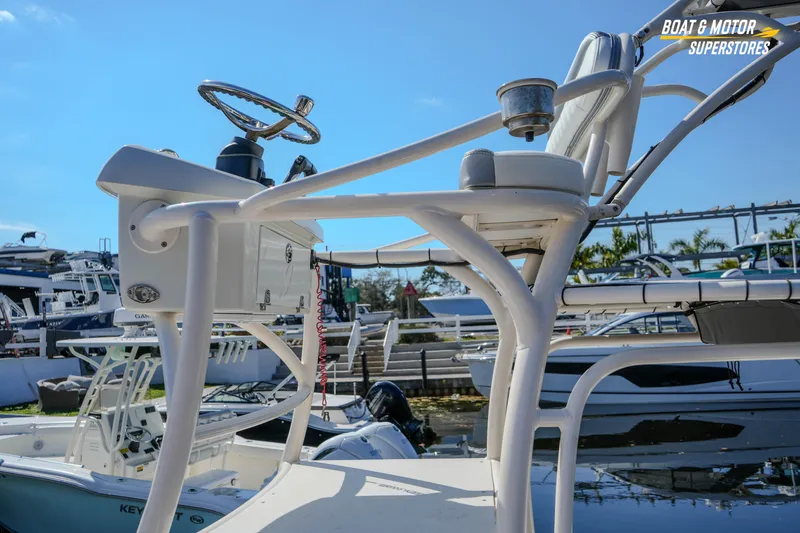  Yacht Photos Pics Boat steering console and seating on a 2016 Young 27 model at a marina.