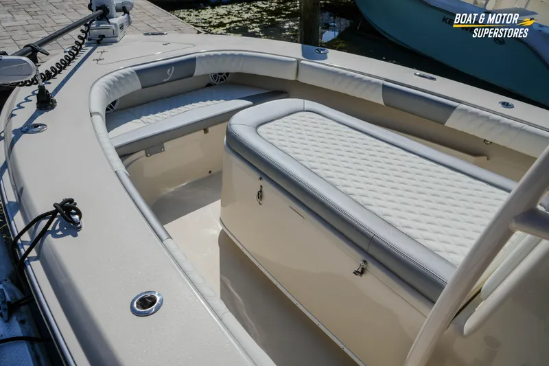  Yacht Photos Pics Interior of a 2016 Young 27 boat with cushioned seating and storage.