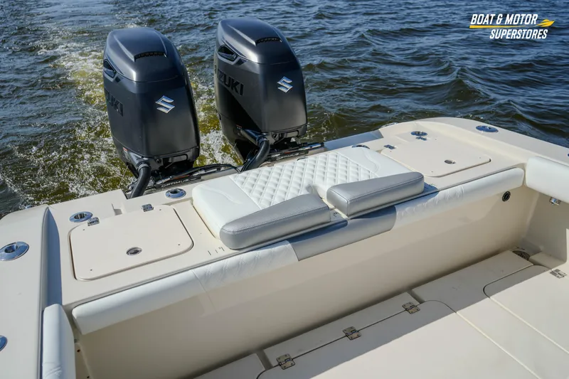  Yacht Photos Pics 2016 Young 27 boat with dual Suzuki outboard motors on water.