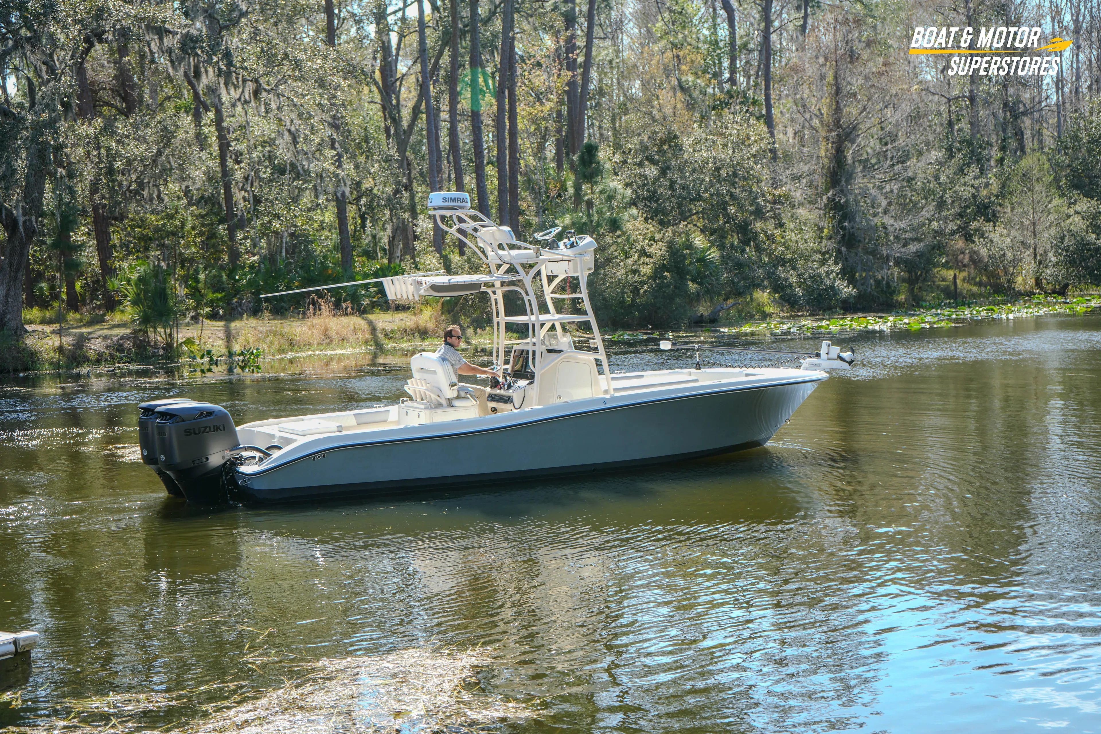  Yacht Photos Pics 2016 Young 27 boat cruising on a serene forested river.