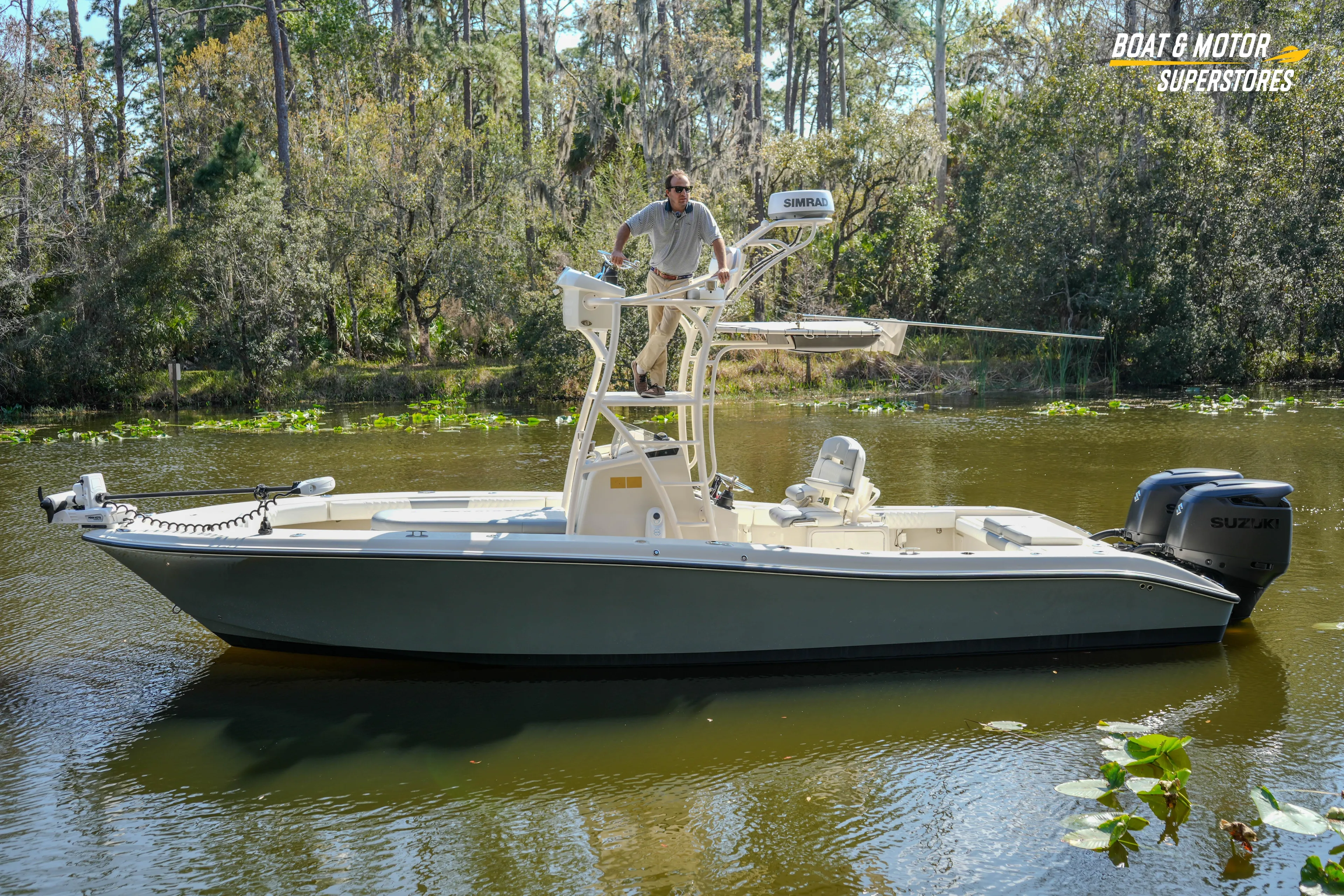  Yacht Photos Pics 2016 Young 27 boat on a calm river with lush forest background.