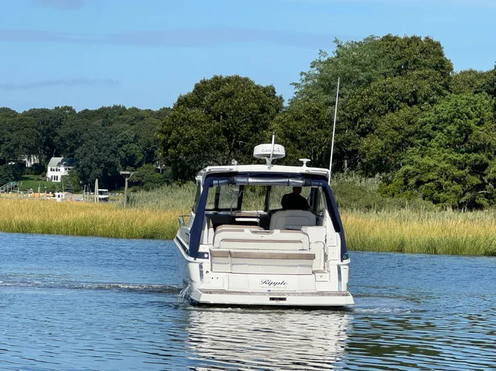 Ripple Yacht Photos Pics 2016 Regal 35 Sport Coupe cruising on a serene river.