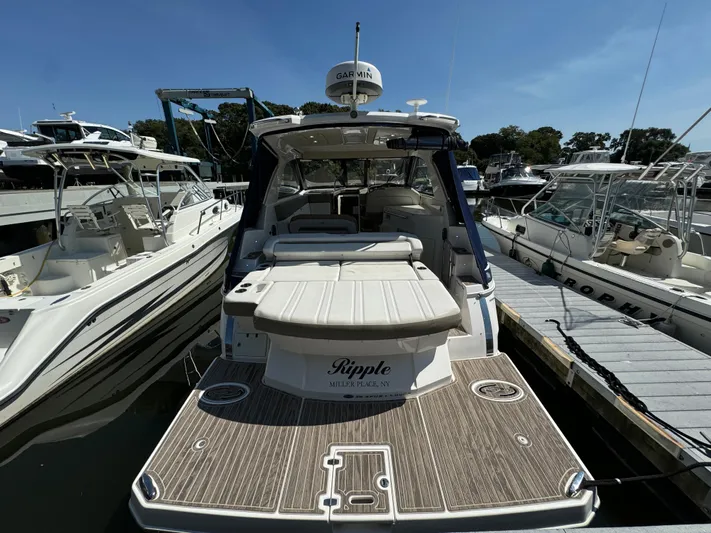 Ripple Yacht Photos Pics 2016 Regal 35 Sport Coupe yacht docked at marina, rear view.