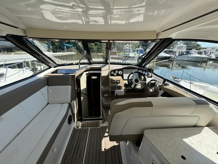 Ripple Yacht Photos Pics Interior of 2016 Regal 35 Sport Coupe yacht with modern helm and seating.