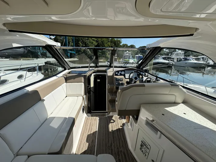 Ripple Yacht Photos Pics Interior of 2016 Regal 35 Sport Coupe yacht with luxurious seating and helm.