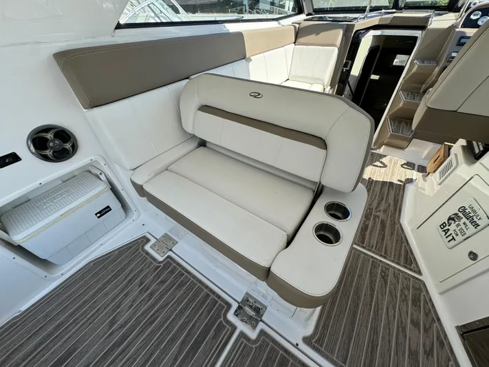 Ripple Yacht Photos Pics Interior of 2016 Regal 35 Sport Coupe with beige seating and cup holders.
