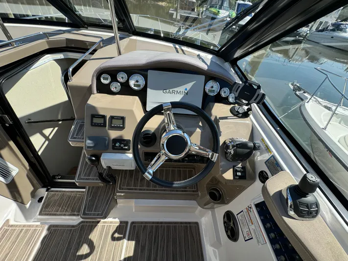 Ripple Yacht Photos Pics 2016 Regal 35 Sport Coupe helm with Garmin navigation system and modern controls.