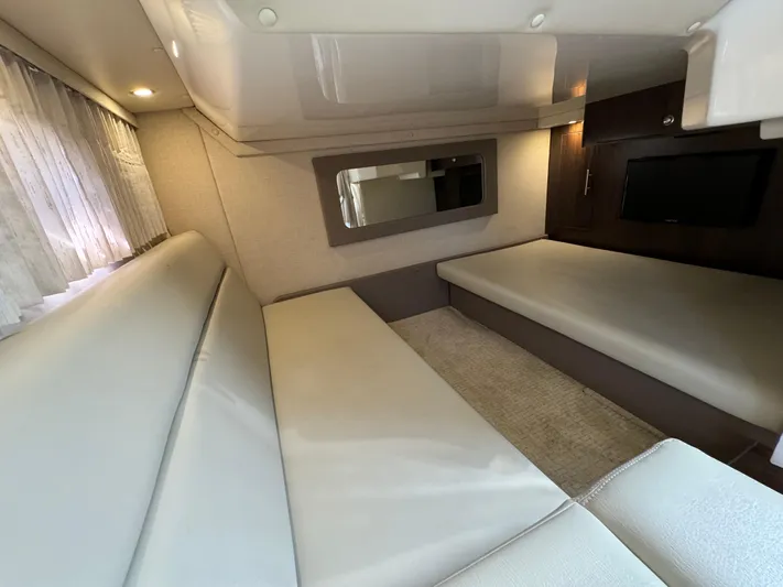 Ripple Yacht Photos Pics Interior of 2016 Regal 35 Sport Coupe, featuring modern seating and a wall-mounted TV.