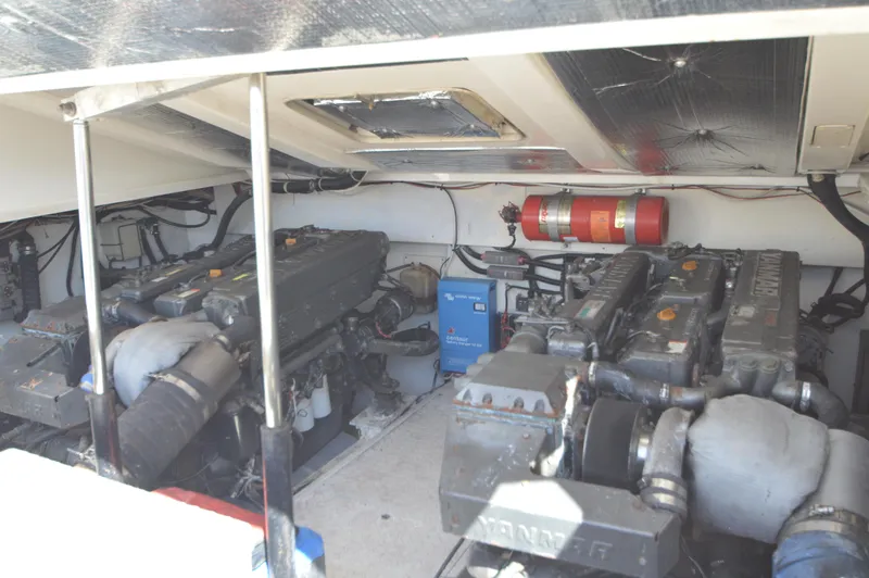 Side Chick Yacht Photos Pics Engine room of 2002 Rampage 38 Express boat with dual Yanmar engines.