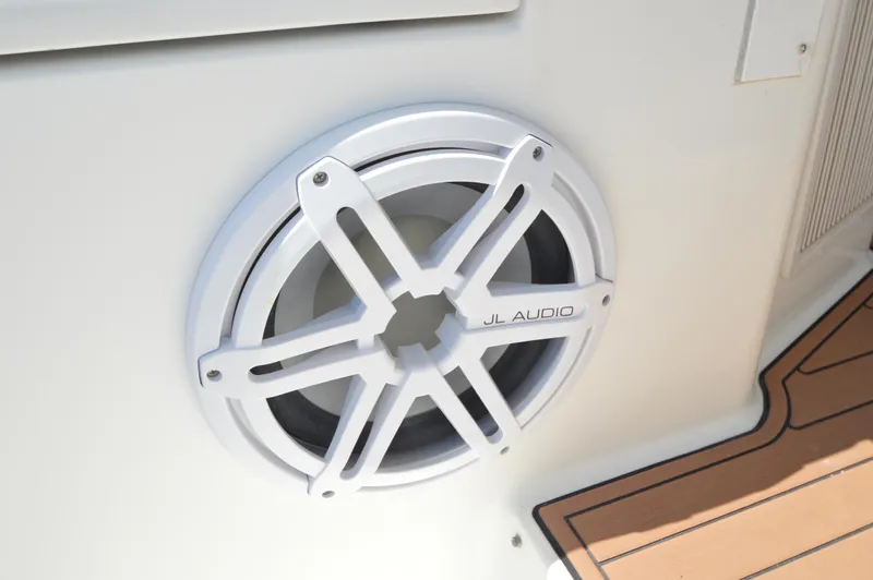 Side Chick Yacht Photos Pics White JL Audio speaker on 2002 Rampage 38 Express boat interior.