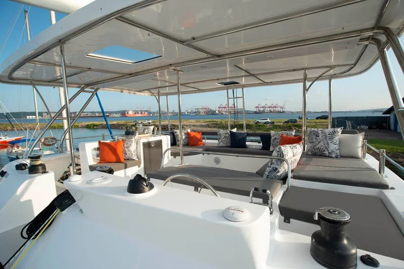 Barefeet Retreat Yacht Photos Pics Luxurious 2020 Royal Cape Catamarans Majestic 570 with spacious deck and stylish seating area.