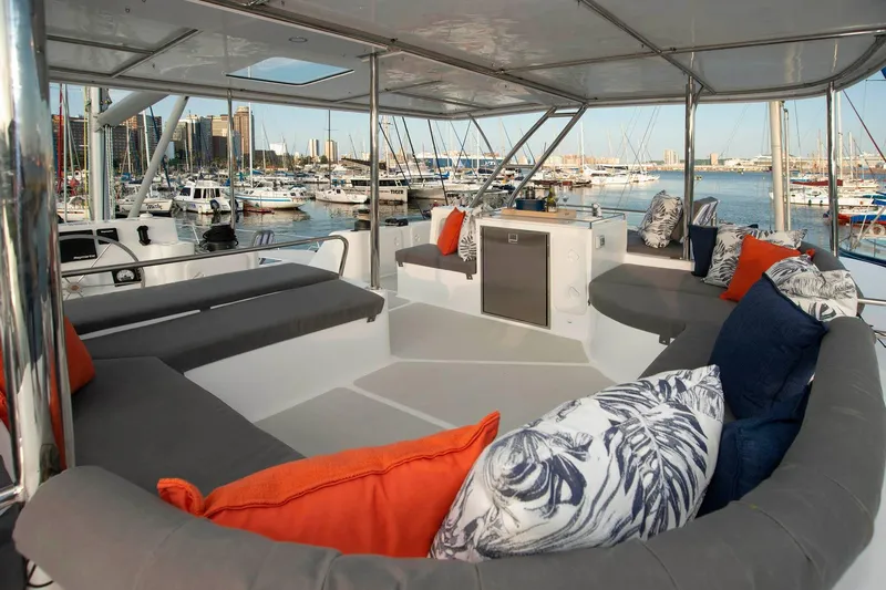 Barefeet Retreat Yacht Photos Pics Luxurious 2020 Royal Cape Catamarans Majestic 570 with spacious deck and vibrant cushions.