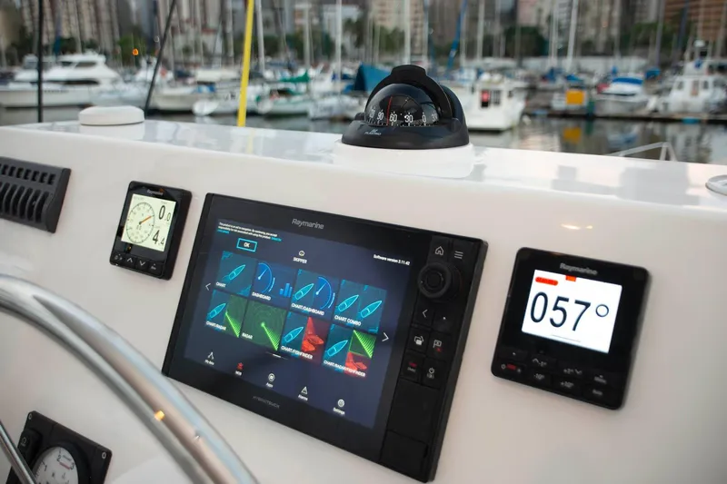 Barefeet Retreat Yacht Photos Pics Helm of 2020 Royal Cape Catamarans Majestic 570 with navigation instruments and compass.