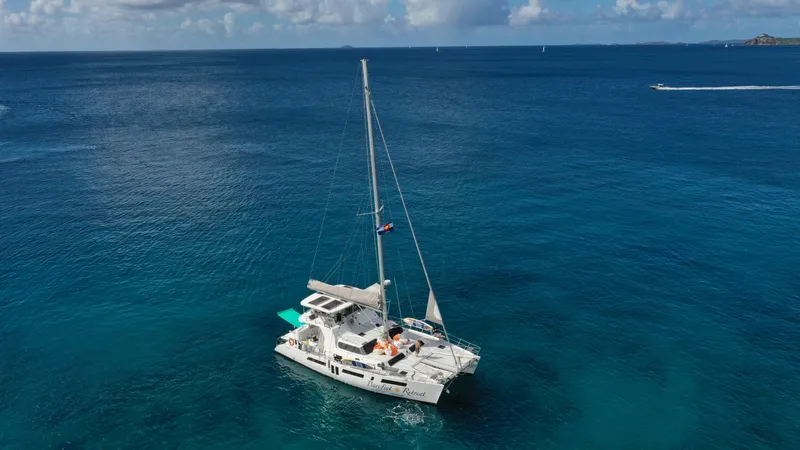 Barefeet Retreat Yacht Photos Pics 2020 Royal Cape Catamarans Majestic 570 sailing on clear blue ocean waters.