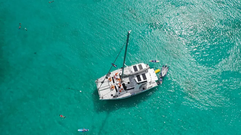 Barefeet Retreat Yacht Photos Pics Aerial view of 2020 Royal Cape Catamarans Majestic 570 on turquoise water.