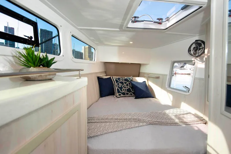Barefeet Retreat Yacht Photos Pics Luxurious cabin interior of 2020 Royal Cape Catamarans Majestic 570 with modern decor.