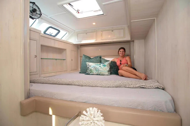 Barefeet Retreat Yacht Photos Pics Luxurious cabin interior of 2020 Royal Cape Catamarans Majestic 570 with comfortable bedding.