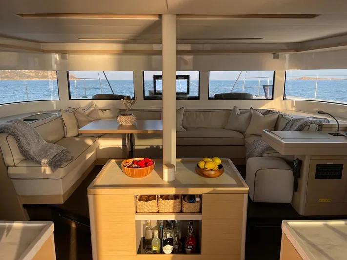  Yacht Photos Pics Luxurious interior of 2021 Lagoon 50 catamaran with elegant seating and ocean view.