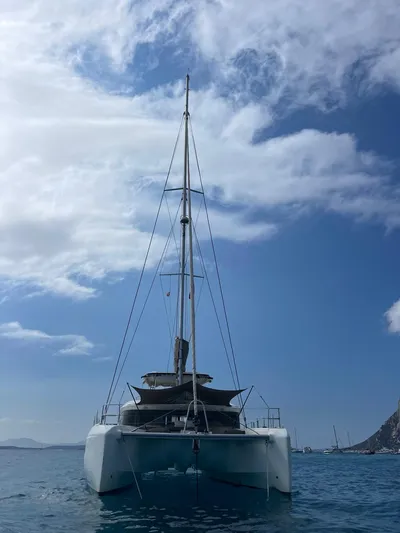  Yacht Photos Pics 2021 Lagoon 50 catamaran on calm sea under a partly cloudy sky.