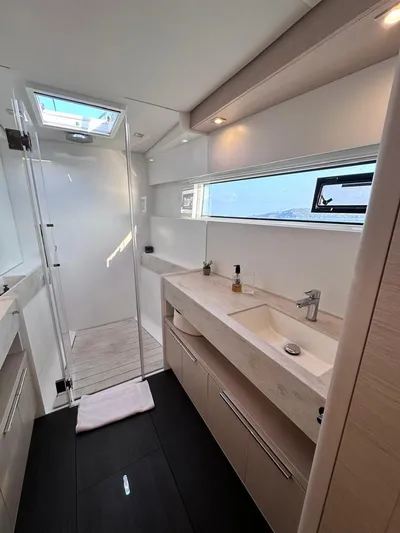  Yacht Photos Pics Modern bathroom interior in 2021 Lagoon 50 yacht, featuring sleek design and natural lighting.