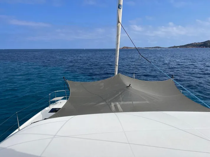  Yacht Photos Pics Lagoon 50 catamaran sailing on clear blue sea, 2021 model.