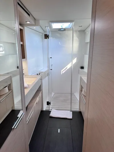  Yacht Photos Pics Modern bathroom interior of 2021 Lagoon 50 yacht, featuring sleek design and natural lighting.