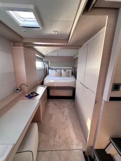  Yacht Photos Pics Luxurious interior of 2021 Lagoon 50 yacht featuring a cozy bedroom and modern design.