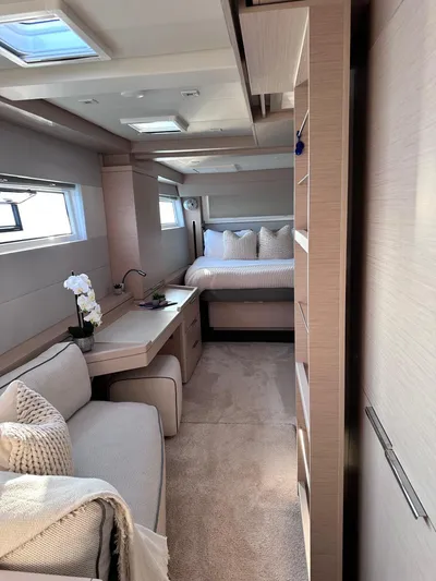  Yacht Photos Pics Luxurious interior of 2021 Lagoon 50 yacht with cozy seating and elegant bedroom.