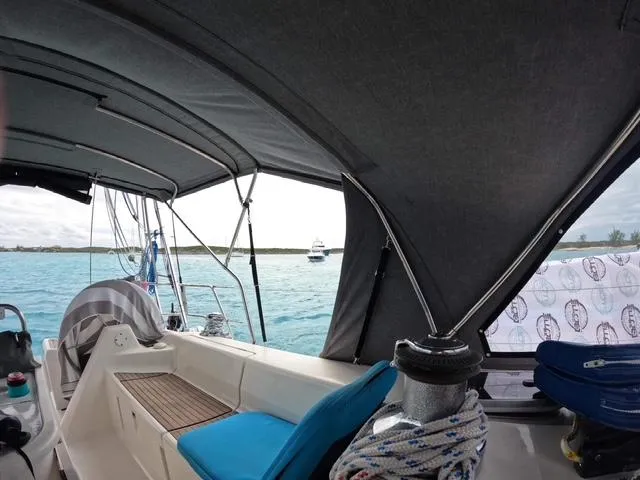 Mockingbird Yacht Photos Pics Cockpit view of 2001 Dufour Gib'Sea 43 sailboat with ocean backdrop.