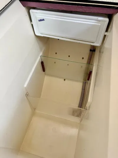 Mockingbird Yacht Photos Pics Empty storage compartment in a 2001 Dufour Gib'Sea 43 sailboat.