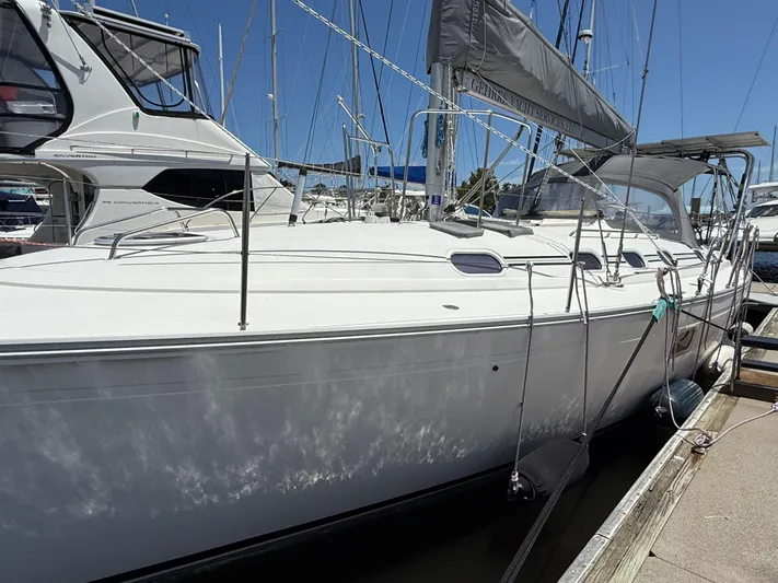 Mockingbird Yacht Photos Pics 2001 Dufour Gib'Sea 43 sailboat docked at marina, side view.
