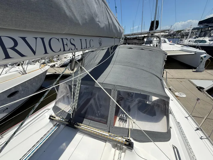 Mockingbird Yacht Photos Pics Sailboat Dufour Gib'Sea 43, 2001 model, docked with covered cockpit and visible rigging.