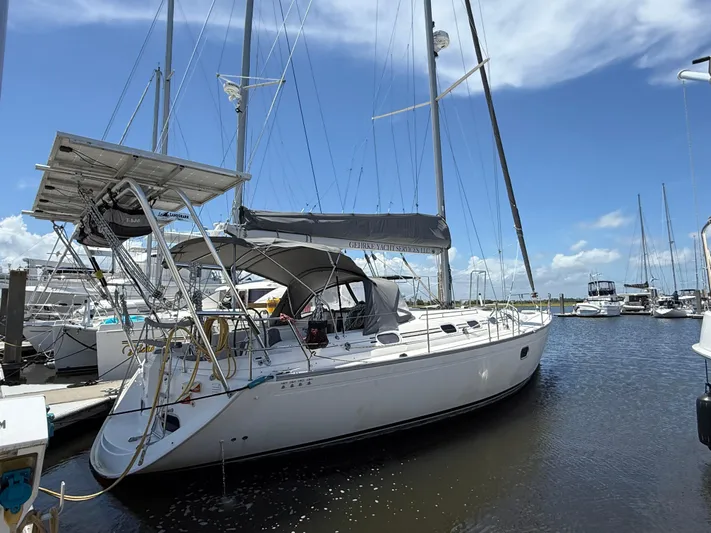 Mockingbird Yacht Photos Pics 2001 Dufour Gib'Sea 43 sailboat docked at marina under clear blue sky.