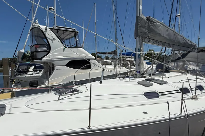 Mockingbird Yacht Photos Pics 2001 Dufour Gib'Sea 43 sailboat docked at marina, clear sky background.