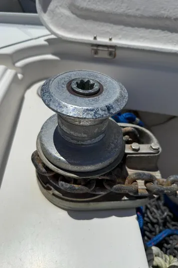 Mockingbird Yacht Photos Pics Anchor windlass on 2001 Dufour Gib'Sea 43 sailboat deck, close-up view.