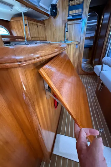 Mockingbird Yacht Photos Pics Interior of 2001 Dufour Gib'Sea 43 yacht with wooden cabinetry and fold-out table.