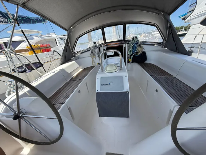 Mockingbird Yacht Photos Pics Cockpit of 2001 Dufour Gib'Sea 43 sailboat with dual steering wheels and canopy.