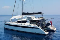 Luxury Privilege 515 catamaran from 2010 on calm blue sea.