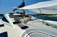 Luxury Privilege 515 yacht deck with seating, table, and sunshade, 2010 model.