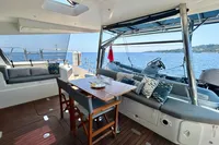 Luxurious Privilege 515 yacht interior with seating, table, and ocean view, 2010 model.