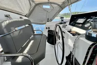 Cockpit of 2010 Privilege 515 yacht with steering wheel and navigation instruments.