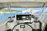 Helm of 2010 Privilege 515 yacht with scenic ocean view.