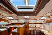 Luxurious interior of 2010 Privilege 515 yacht with skylights and elegant dining area.