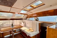 Luxurious interior of 2010 Privilege 515 yacht with elegant seating and skylights.